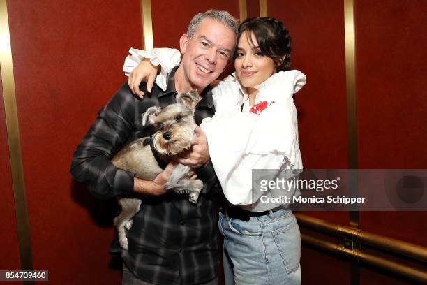 Singer-songwriter Camila Cabello poses for a photo with host Elvis Duran and his dog Max when she visits "The Elvis Duran Z100 Morning Show" at Z100...