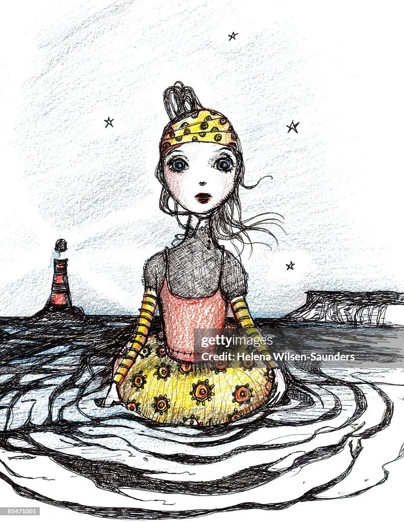 A woman standing in the ocean and a lighthouse in the distance