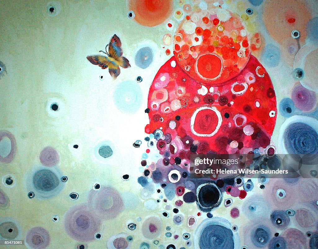 A decorative illustration of a butterfly and burst of colors