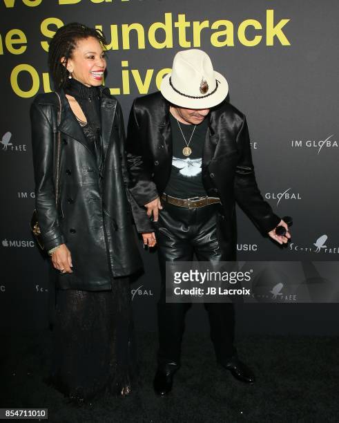 Cindy Blackman and Carlos Santana attend the premiere of Apple Music's "Clive Davis: The Soundtrack Of Our Lives" on September 26, 2017 in Los...