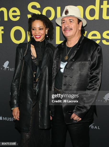 Cindy Blackman and Carlos Santana attend the premiere of Apple Music's "Clive Davis: The Soundtrack Of Our Lives" on September 26, 2017 in Los...