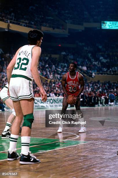 Charles Oakley of the Chicago Bulls looks to make a move against Kevin McHale of the Boston Celtics during Game One of the Eastern Conference...