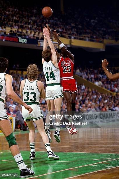 Michael Jordan of the Chicago Bulls shoots over Danny Ainge of the Boston Celtics during Game One of the Eastern Conference Quarterfinals played on...