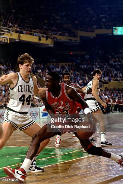 Michael Jordan of the Chicago Bulls drives to the basket against Danny Ainge of the Boston Celtics during Game One of the Eastern Conference...
