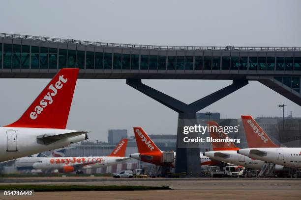 Passenger aircraft operated by EasyJet Plc stand at gates at London Gatwick airport in Crawley, U.K., on Wednesday, Sept. 27, 2017. EasyJet revealed...