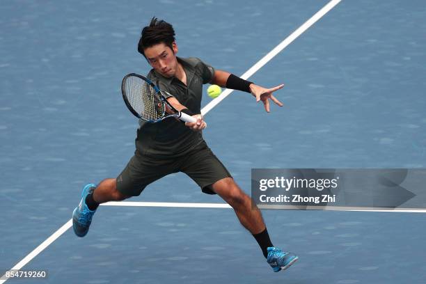 Yuichi Sugita of Japan returns a shot during the match against Thiago Monteiro of Brazil during Day 3 of 2017 ATP Chengdu Open at Sichuan...