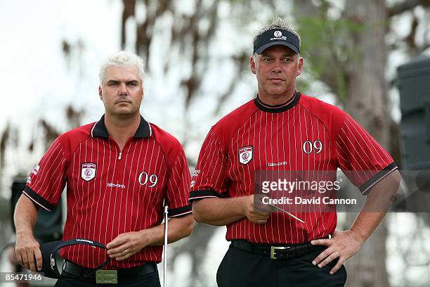 Daniel Chopra of Sweden and Darren Clarke of Northern Ireland and the Isleworth team wait on the 18th hole during the second day of the 2009...