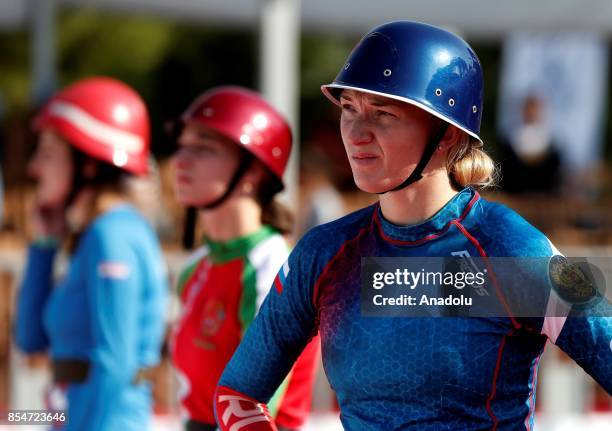 Woman firefighter competes during the 13th World Championship, among men and VI World Championship among women in fire and rescue sports, with the...