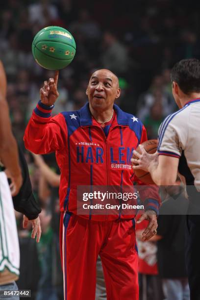 Harlem Globetrotter's Legend Curly Neal spins a basketball on his finger prior to the NBA game between the Boston Celtics and the Chicago Bulls on...