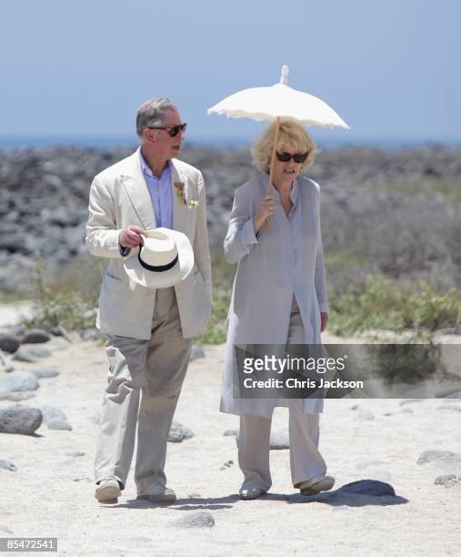 Prince Charles, Prince of Wales and Camilla, Duchess of Cornwall walk along the beach on North Seymour Island on the second day of a tour of the...