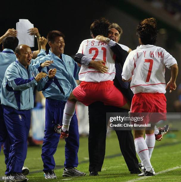 Ji Sung Park of South Korea celebrates with coach Guus Hiddink after scoring the winning goal during the FIFA World Cup Finals 2002 Group D match...