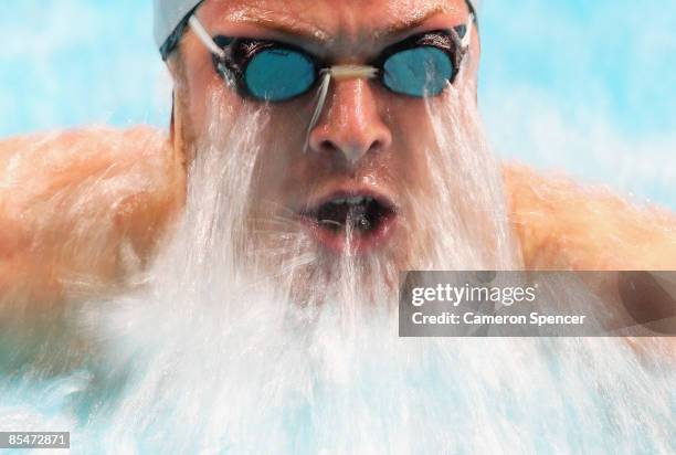 Glenn Snyders of New Zealand in action during his mens 100m breastroke heat during day two of the 2009 Australian Swimming Championships at the...