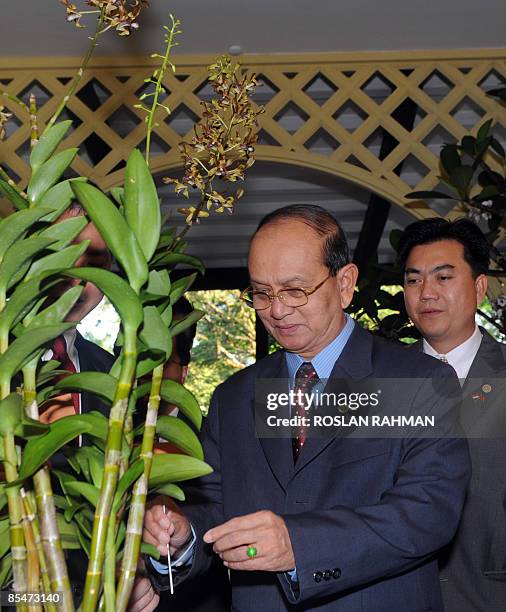 Myanmar's Prime Minister General Thein Sein attending the naming of Orchid plant, Dendrobium Thien Sein during his visit at the Botanical Garden in...
