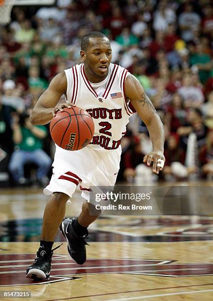 Devan Downey of the South Carolina Gamecocks works to drive inside against the Davidson Wildcats at the Colonial Life Arena on March 17, 2009 in...