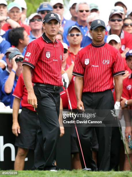 Charles Howell III and teammate Tiger Woods of the U.S. And the Isleworth Team look on at the eighth hole during the second day of the 2009 Tavistock...