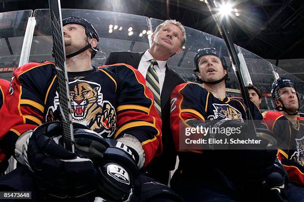 Assistant Coach Mike Kitchen of the Florida Panthers talks to Nick Tarnasky and Jassen Cullimore during the game against the Washington Capitals at...