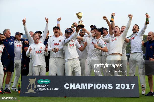 Essex players lift the County Championship trophy during day three of the Specsavers County Championship Division One match between Essex and...