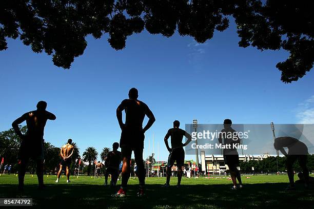Swans players recover after completing a yo-yo test during a Sydney Swans AFL training session at Lakeside Oval on March 18, 2009 in Sydney,...