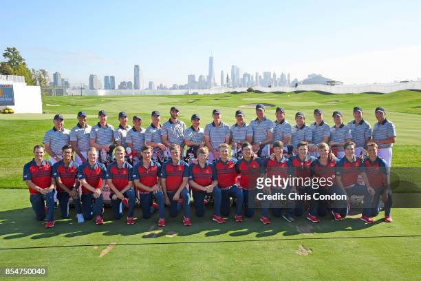 The U.S. Team and the U.S. Junior Presidents Cup team poses for a group photo prior to the start of the Presidents Cup at Liberty National Golf Club...