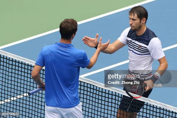 Dusan Lajovic of Serbia shakes hands with Albert Ramos-Vinolas of Spain after the match during Day 3 of 2017 ATP Chengdu Open at Sichuan...