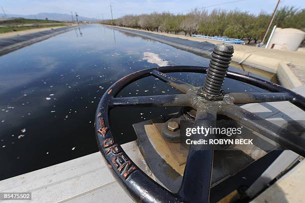 By TANGI QUEMENER A gate controls the water flow on an irrigation canal in Firebaugh, California in the state's San Joaquin Valley on March 11, 2009....