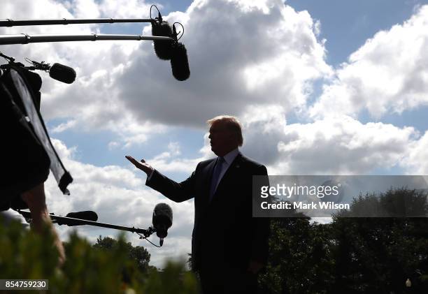 President Donald Trump speaks to the media before departing from the White House on September 27, 2017 in Washington, DC. President Trump is...