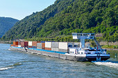 shipping containers on river barge