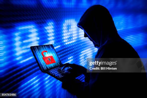 blue code hacker - ominous computer stock pictures, royalty-free photos & images
