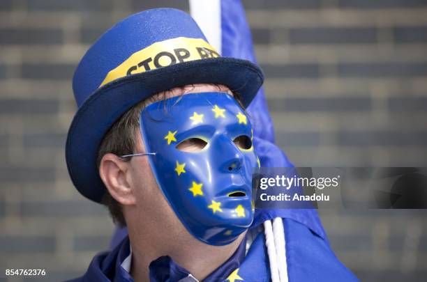 Pro-Europe campaigner wearing a mask with European Union flag is seen outside the Brighton Centre ahead of Labour Party leader Jeremy Corbyn's...