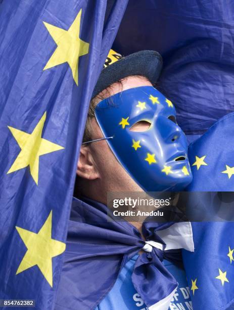 Pro-Europe campaigner wearing a mask with European Union flag is seen outside the Brighton Centre ahead of Labour Party leader Jeremy Corbyn's...