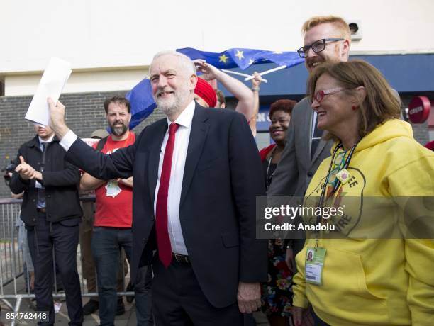 Labour Party leader Jeremy Corbyn is greeted by delegates as he arrives to deliver his keynote speech at the Labour Party on the annual conference at...