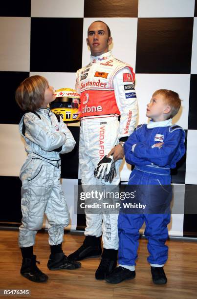 Driver, Lewis Hamilton has his waxwork unveiled at Madame Tussauds and appears with F1 champs of the future Billy Monger and Myles Apps on March 18,...