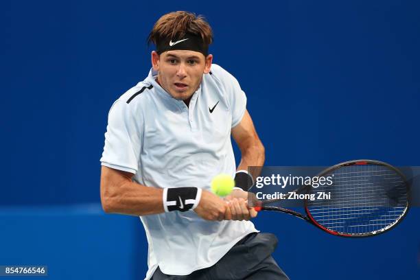 Jared Donaldson of the United States returns a shot during the match against Kyle Edmund of Great Britain during Day 3 of 2017 ATP Chengdu Open at...