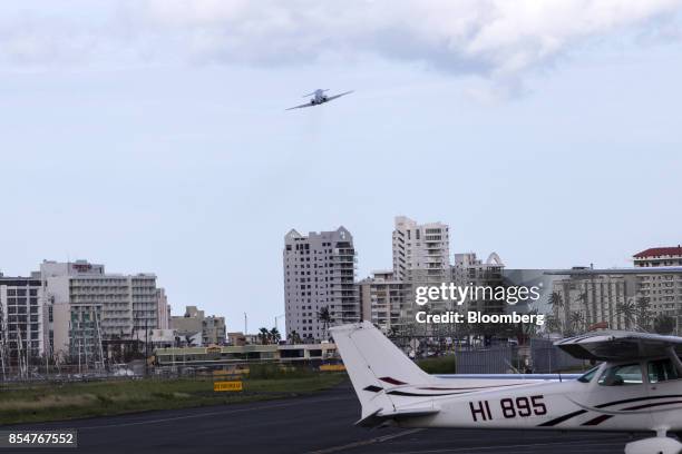 An aircraft takes off from Isla Grande Airport airport in San Juan, Puerto Rico, on Monday, Sept. 25, 2017. Hurricane Maria hit the Caribbean island...