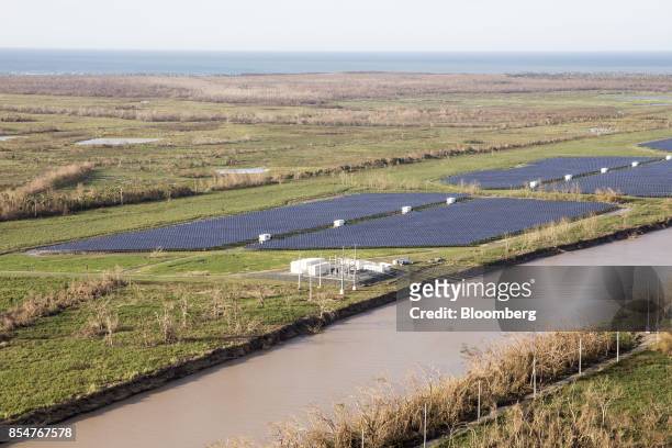 Solar panels are seen in a field in this aerial photograph taken above Carolina, Puerto Rico, on Monday, Sept. 25, 2017. Hurricane Maria hit the...