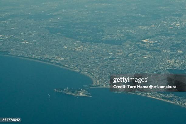 sagami bay, enoshima island, and fujisawa, chigasaki and kamakura cities in kanagawa prefecture daytime aerial view from airplane - chigasaki beach stock pictures, royalty-free photos & images