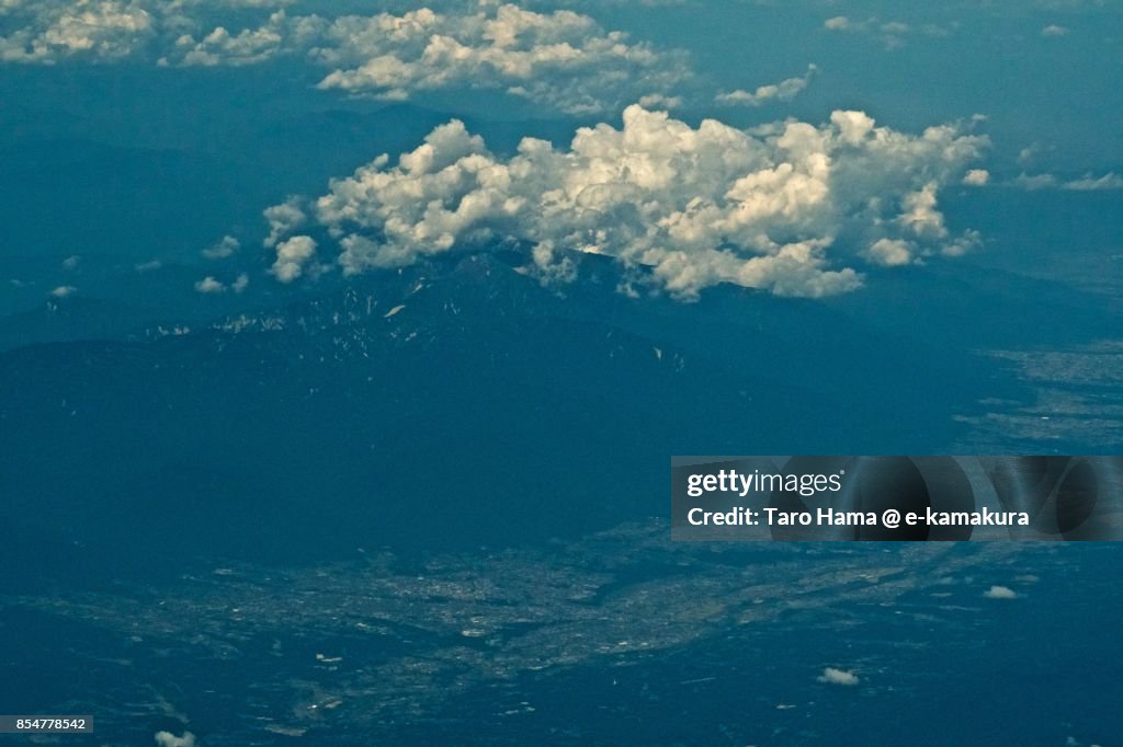 Kiso Mountains and Iida city in Nagano prefecture daytime aerial view from airplane