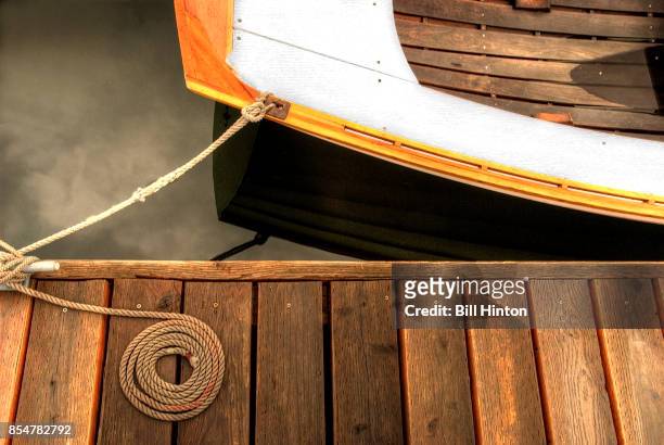 tethered rowboat - timber deck stock-fotos und bilder