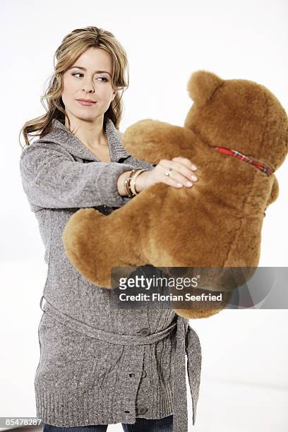 Bettina Cramer poses pregnant of seven months with a teddy bear on January 15, 2009 in Berlin, Germany. The TV presenter gave birth to her twins...