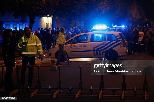 Police are pictured outside the stadium prior to the UEFA Champions League group B match between RSC Anderlecht and Celtic FC at Constant Vanden...