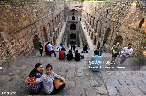 Tourists visit the Agrasen ki Baoli designated a protected monument by the Archaeological Survey of India under the Ancient Monuments and...
