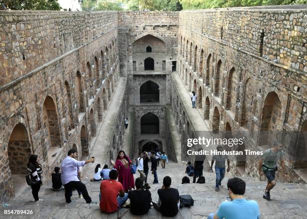 Tourists visit the Agrasen ki Baoli designated a protected monument by the Archaeological Survey of India under the Ancient Monuments and...