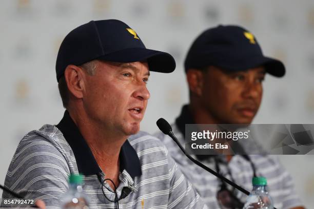 Captain's assistant Davis Love III of the U.S. Team and Captain's assistant Tiger Woods of the U.S. Team attend a press conference during practice...