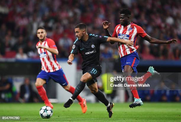 Thomas Partey of Atletico Madrid chases down Eden Hazard of Chelsea during the UEFA Champions League group C match between Atletico Madrid and...