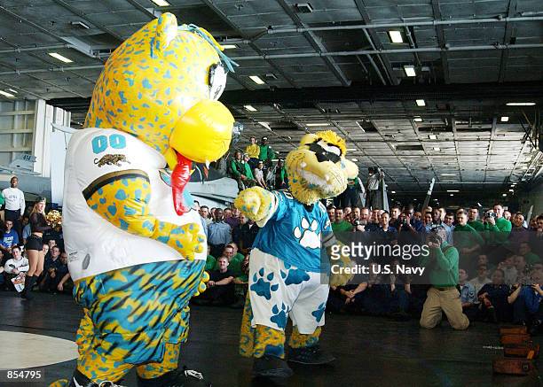 And "Jaxson," mascots for the Jacksonville ''Jaguars'' football team entertain the crew of the USS Theodore Roosevelt December 19, 2001 while at sea....