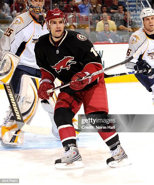 Matthew Lombardi of the Phoenix Coyotes looks for the puck against the Nashville Predators on March 14, 2009 at Jobing.com Arena in Glendale, Arizona.