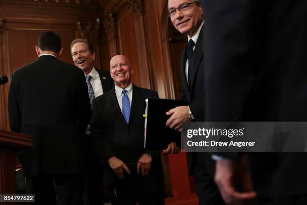 Rep. Vern Buchanan , House Ways and Means Committee chairman Kevin Brady and Rep. David Schweikert mingle as they arrive for a press event to discuss...