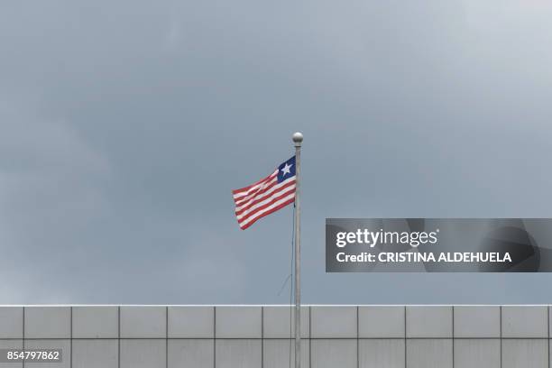 General view taken on September 27, 2017 shows the Liberian Flag on the facade of the Samuel Kanyon Doe Sports Complex in Monrovia, Liberia. - The...