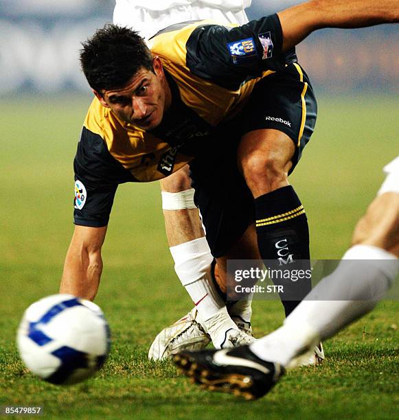 Australia's Central Coast Mariners Mrdja Nikola fights for the ball during the AFC Champions League group H football match against China's Tianjin...
