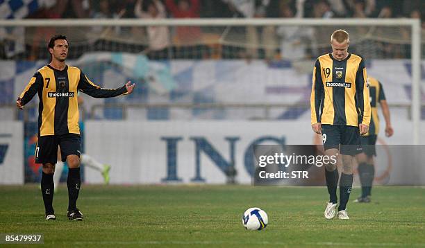 Australia's Central Coast Mariners Hutchinson Paul and Simon Blake react after losing a goal against China's Tianjin Teda during the AFC Champions...